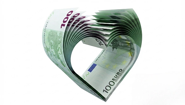 Ein Herz aus Geldscheinen macht deutlich, dass eine Investition in die eigene seelische Gesundheit langfristig bereichern kann. Sogar über den Tod hinaus.