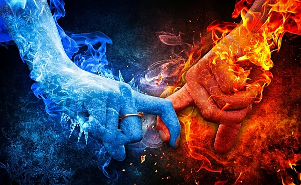 Zwei ineinandergreifende Hände mit Eis und Feuer als Ausdruck innerer Gegensätze in der Reinkarnationstherapie bei Brustkrebs.